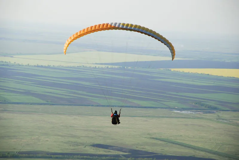 Woman injured after paragliding crash